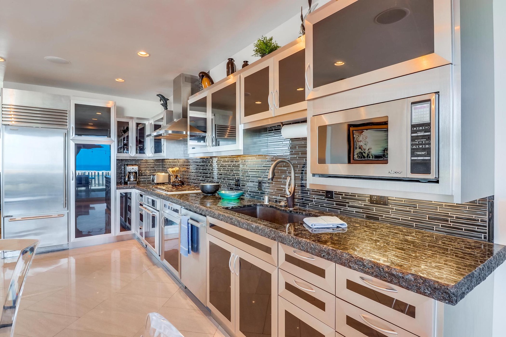 Stone counters and glass backsplash