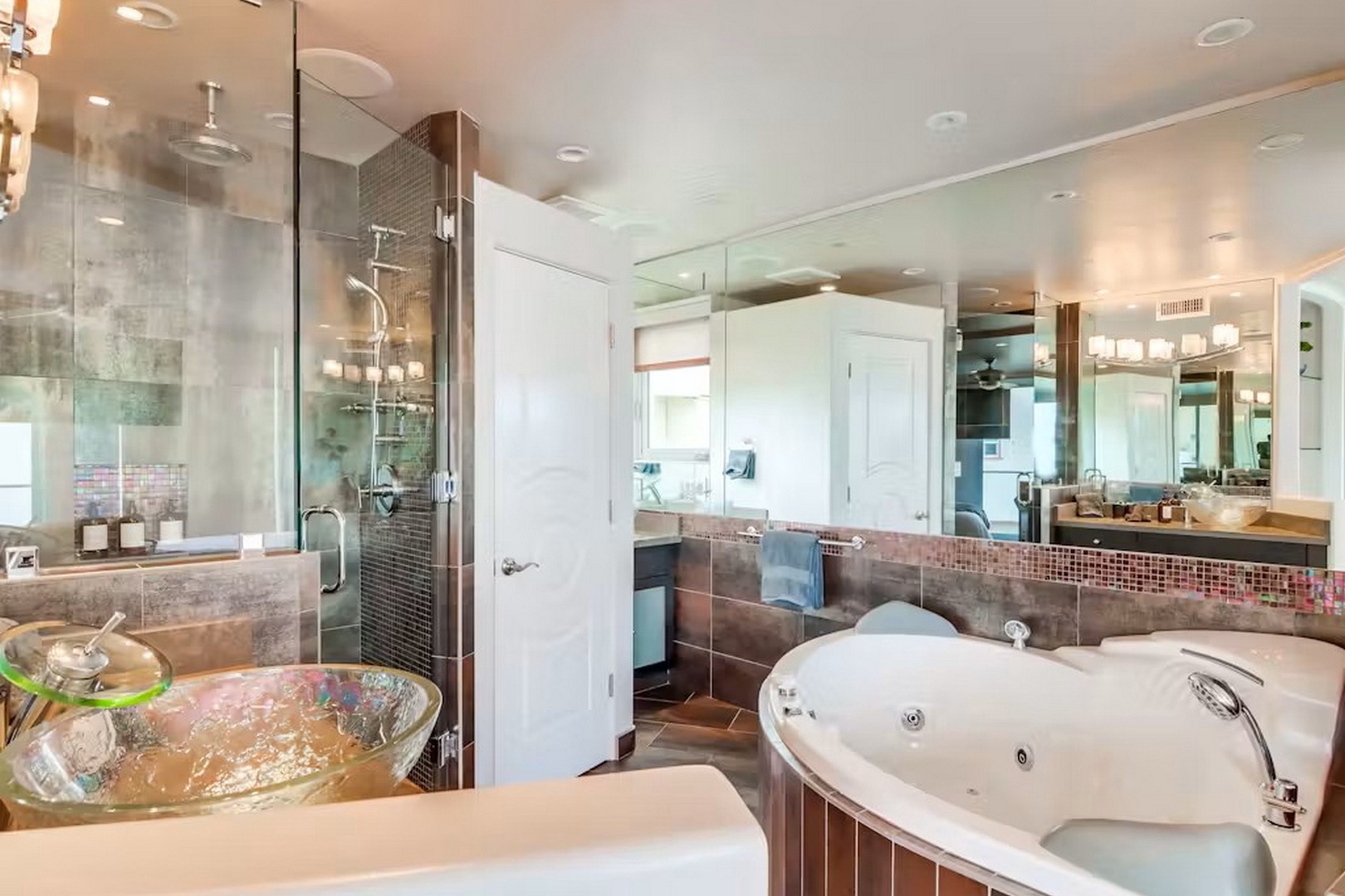 Unwind in your luxurious spa-like bathroom, featuring a soaking tub, walk-in shower, and elegant modern finishes designed for pure relaxation.
