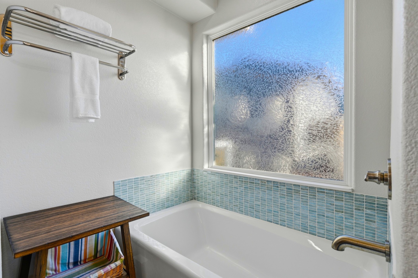 En suite bath with tub and shower