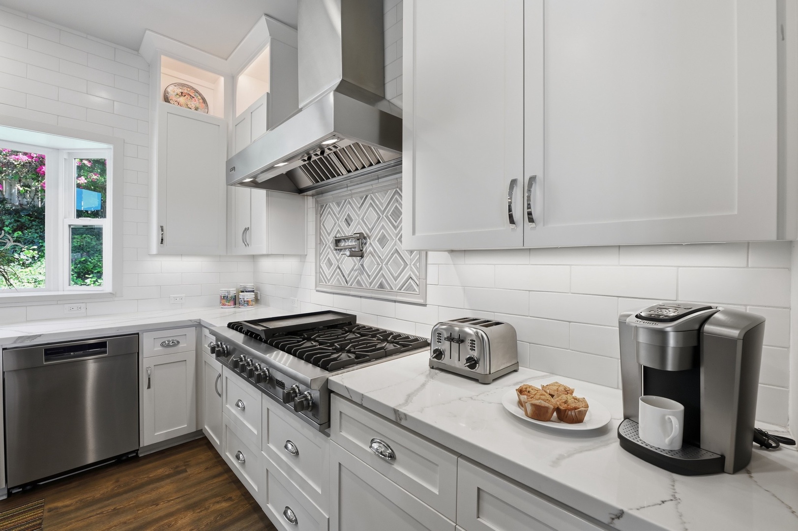 Your fully equipped kitchen features modern appliances and marble counters, perfect for preparing delicious meals during your stay.