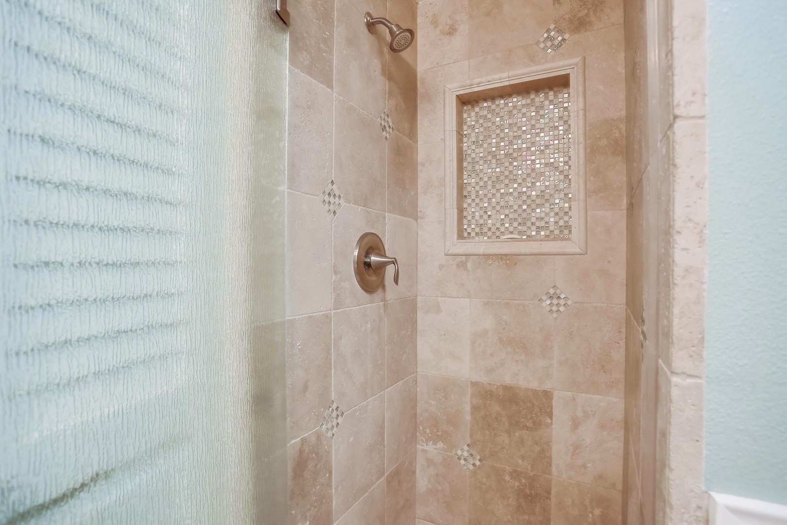 Travertine shower in hall bath