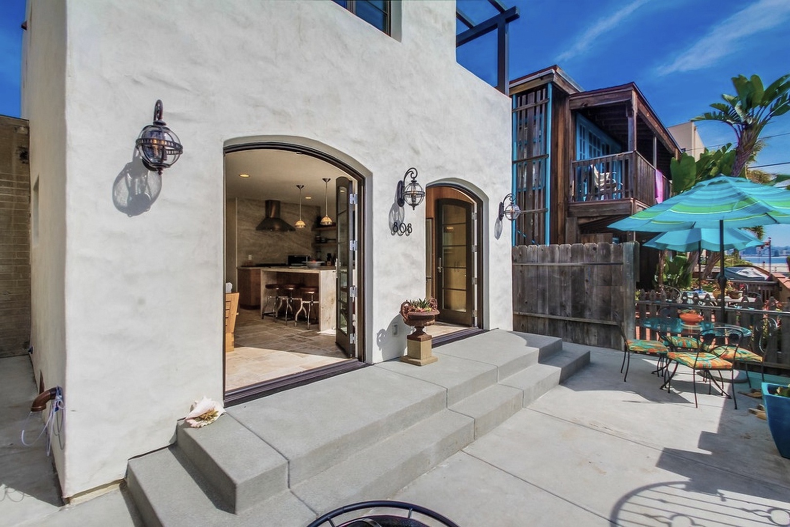 Arched French doors open to the patio
