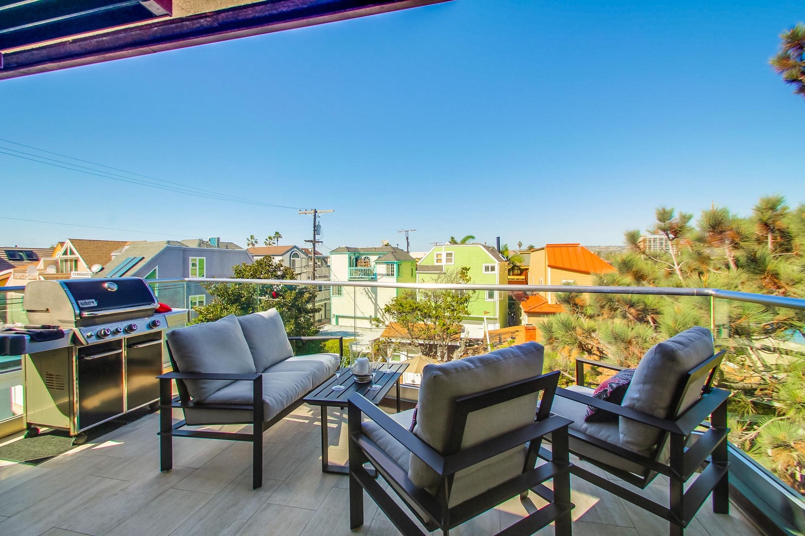 Balcony features seating area and BBQ