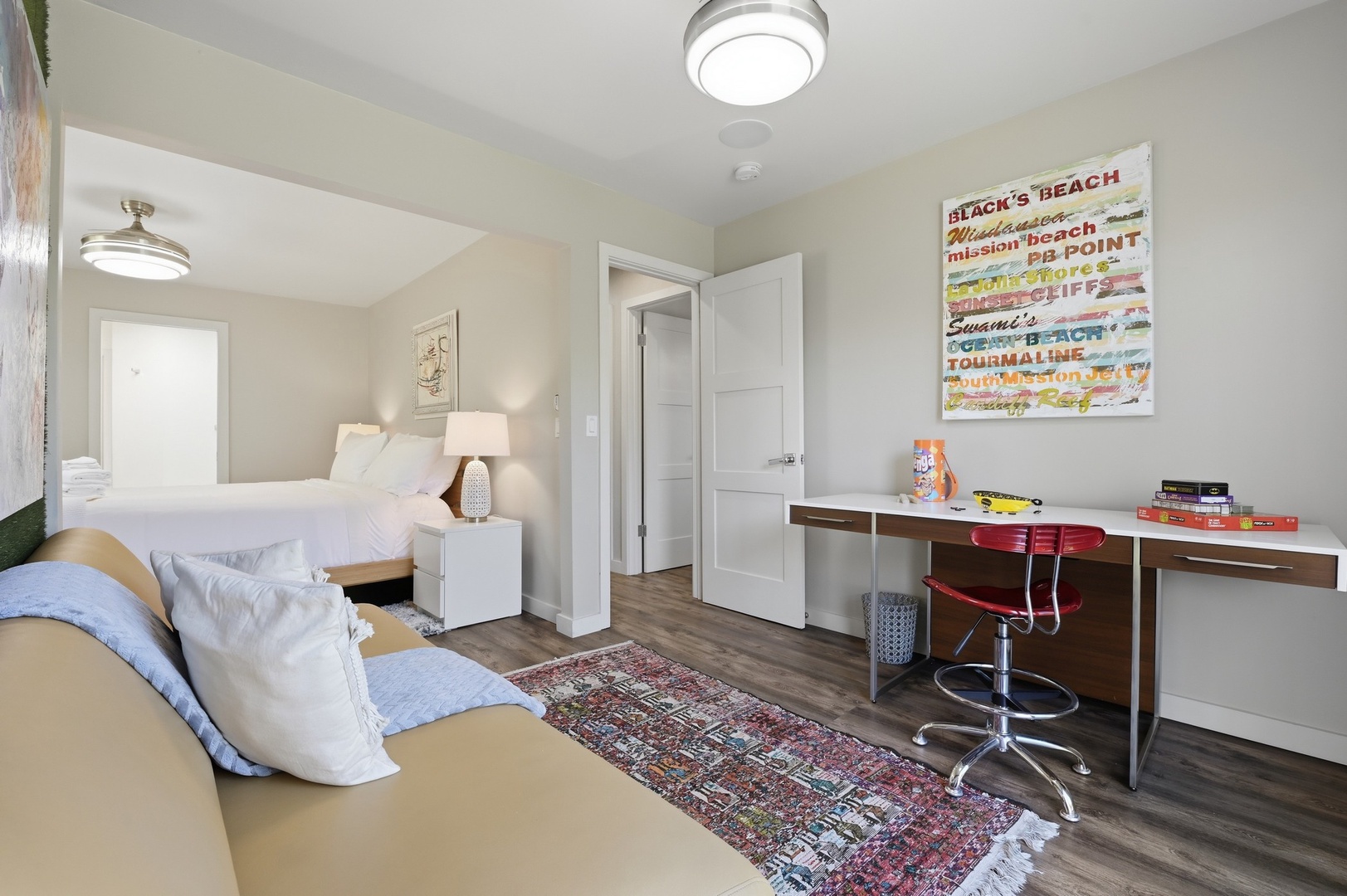 Your bright bedroom retreat combines comfort with productivity—relax on the cozy bed or catch up on work at your dedicated desk space.