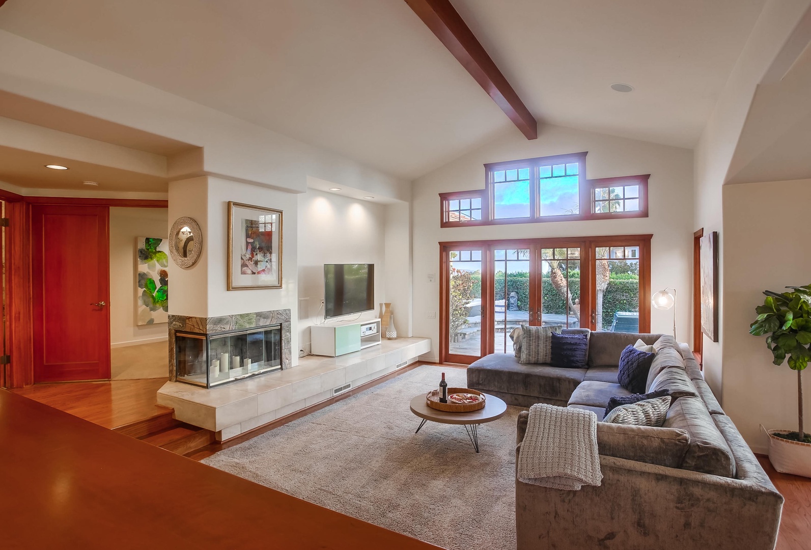 Spacious living room with TV