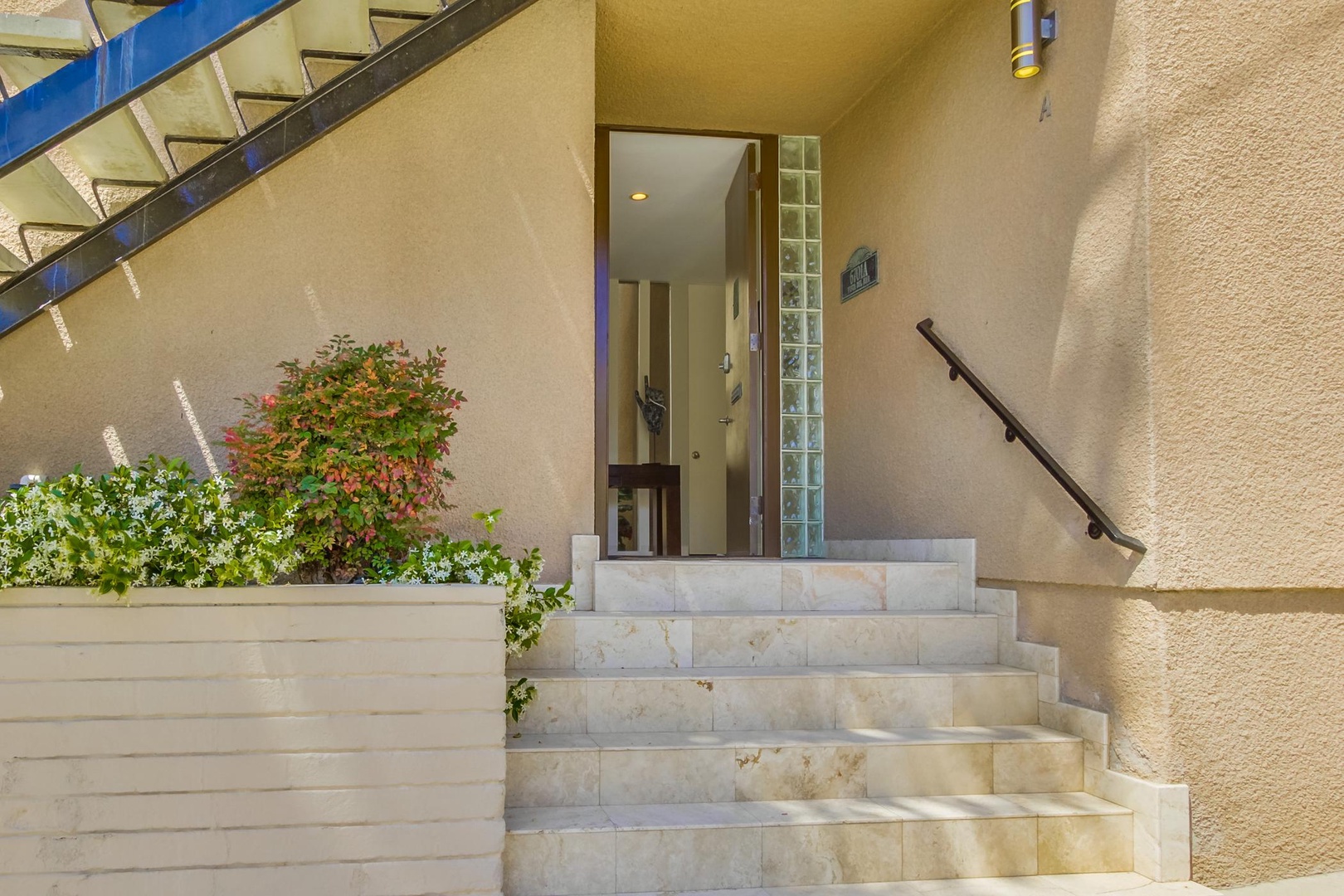 Stairs leading to property entrance