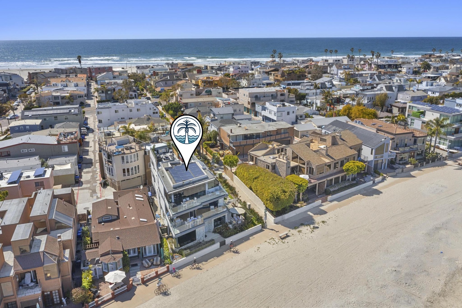 The beach and ocean are across the strand