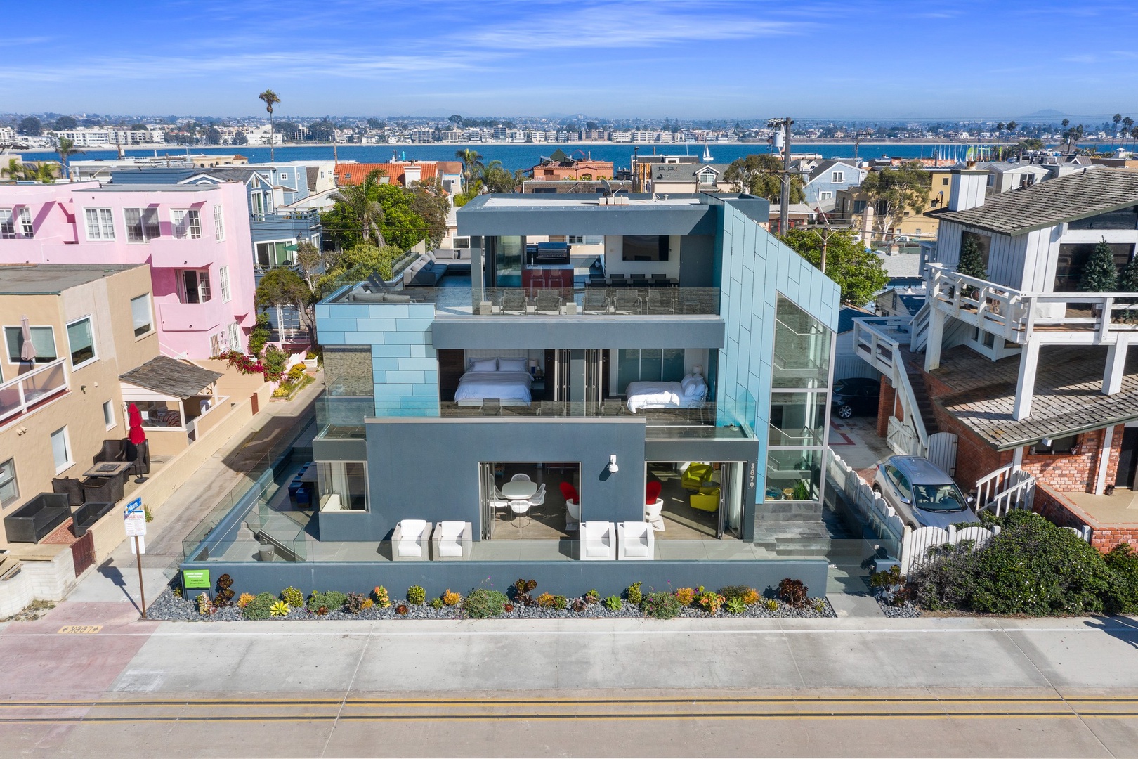 Walls of windows open to the beach