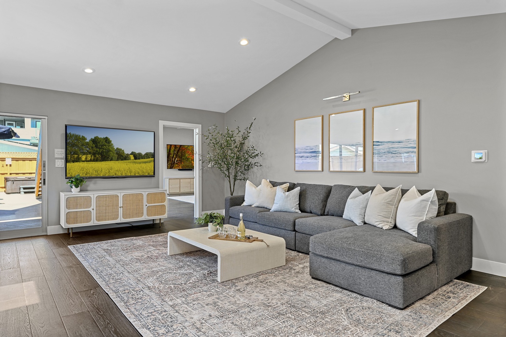Living room with large sectional and TV