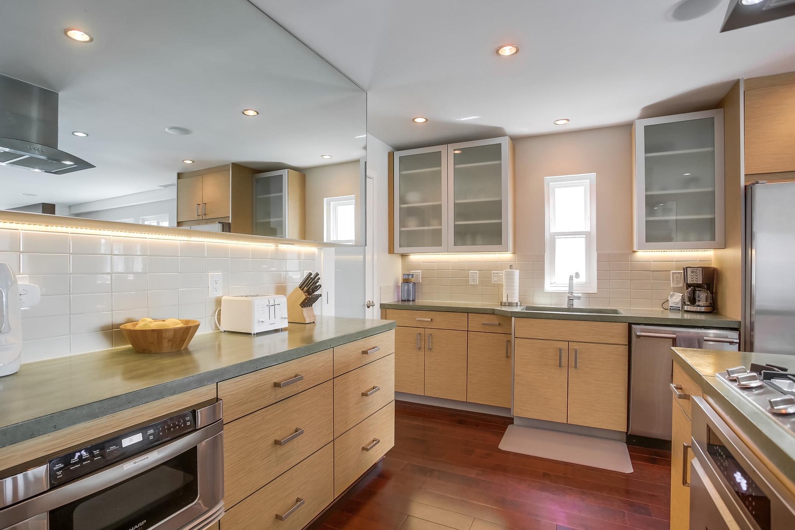 Custom cabinetry and tile backsplash