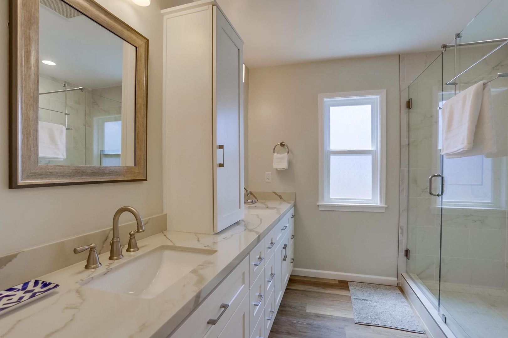 Hall bathroom with dual sinks