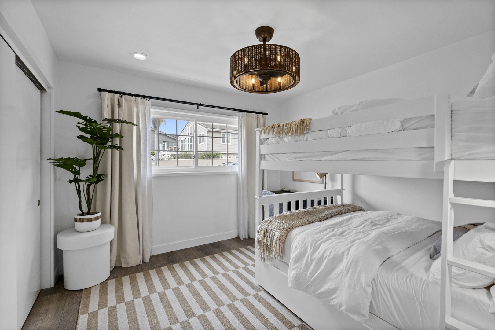 Main level guest bedroom with full over full bund & twin trundle