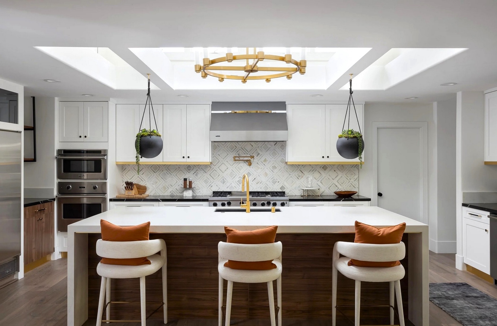Cook memorable meals in your stunning gourmet kitchen, featuring gleaming countertops, premium appliances, and stylish seating for three.