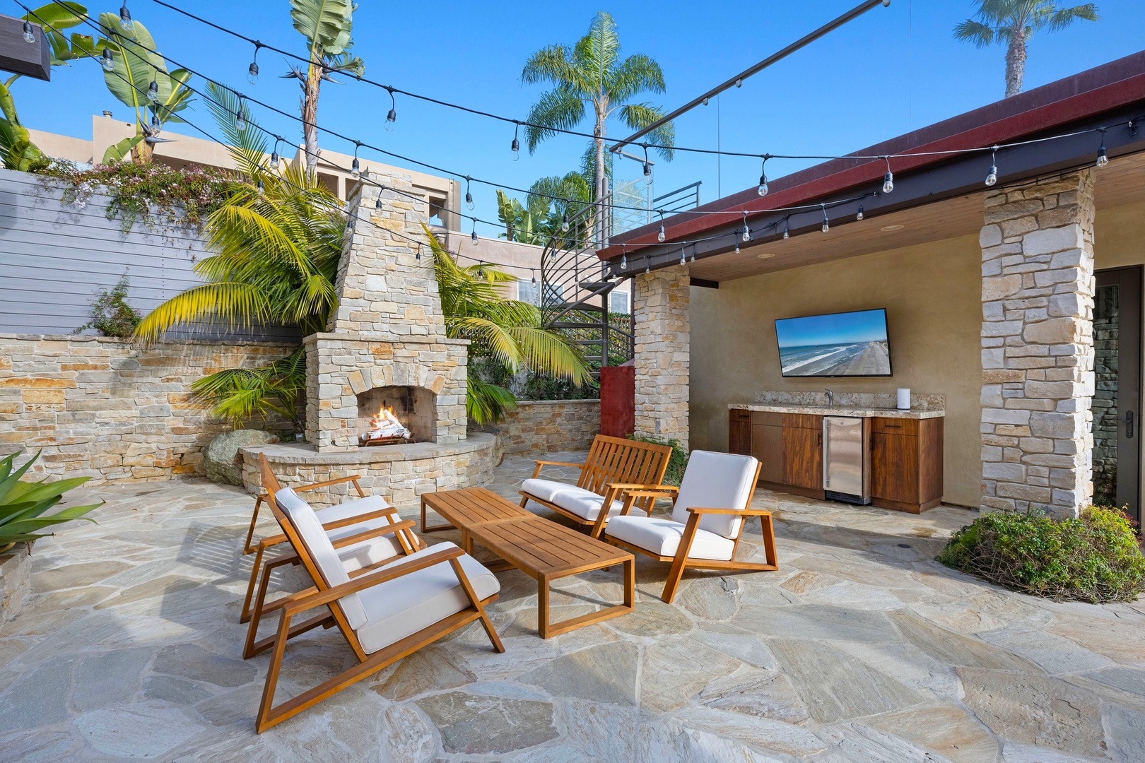 Courtyard lounge with fireplace and wet bar