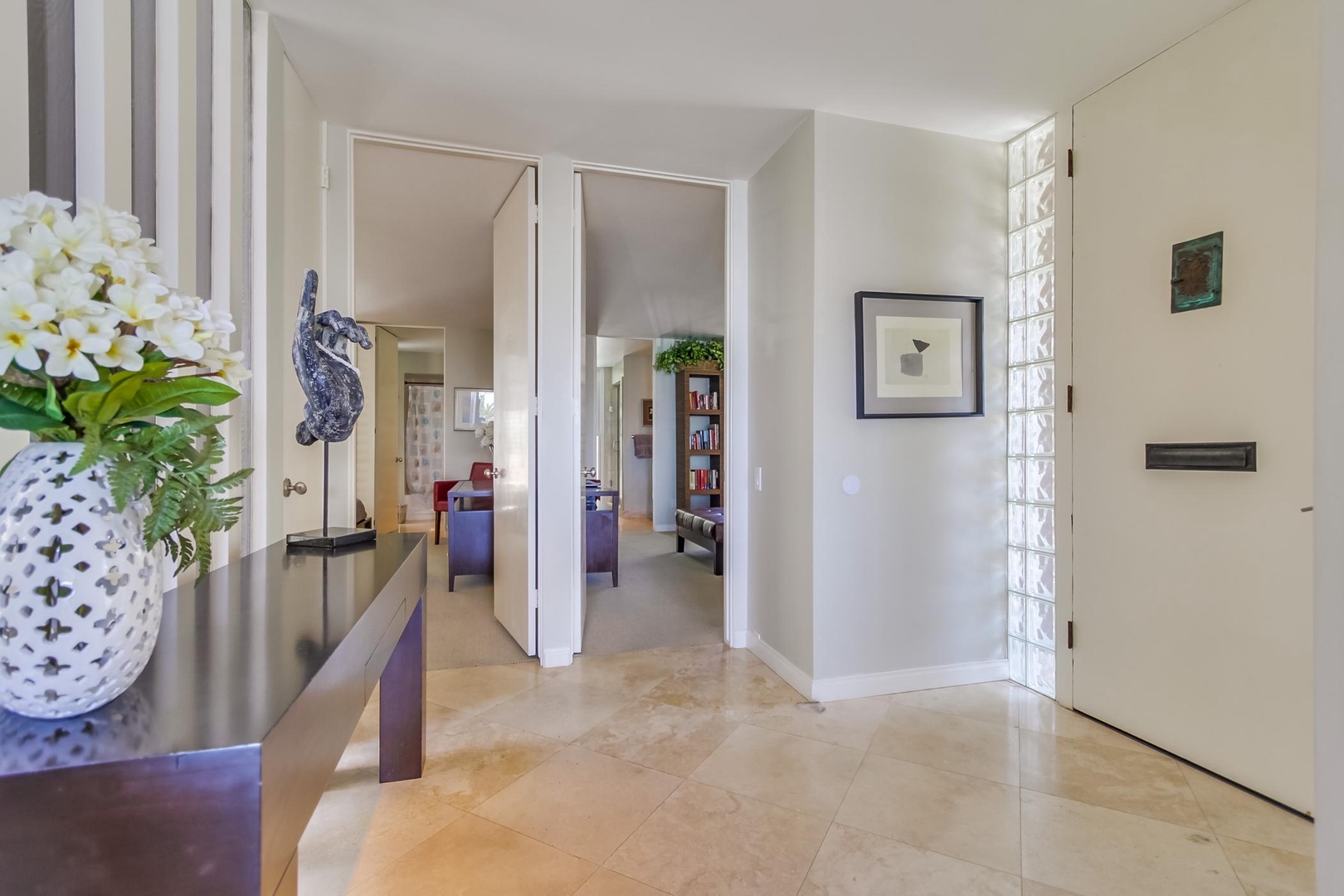 Foyer opening up to living area