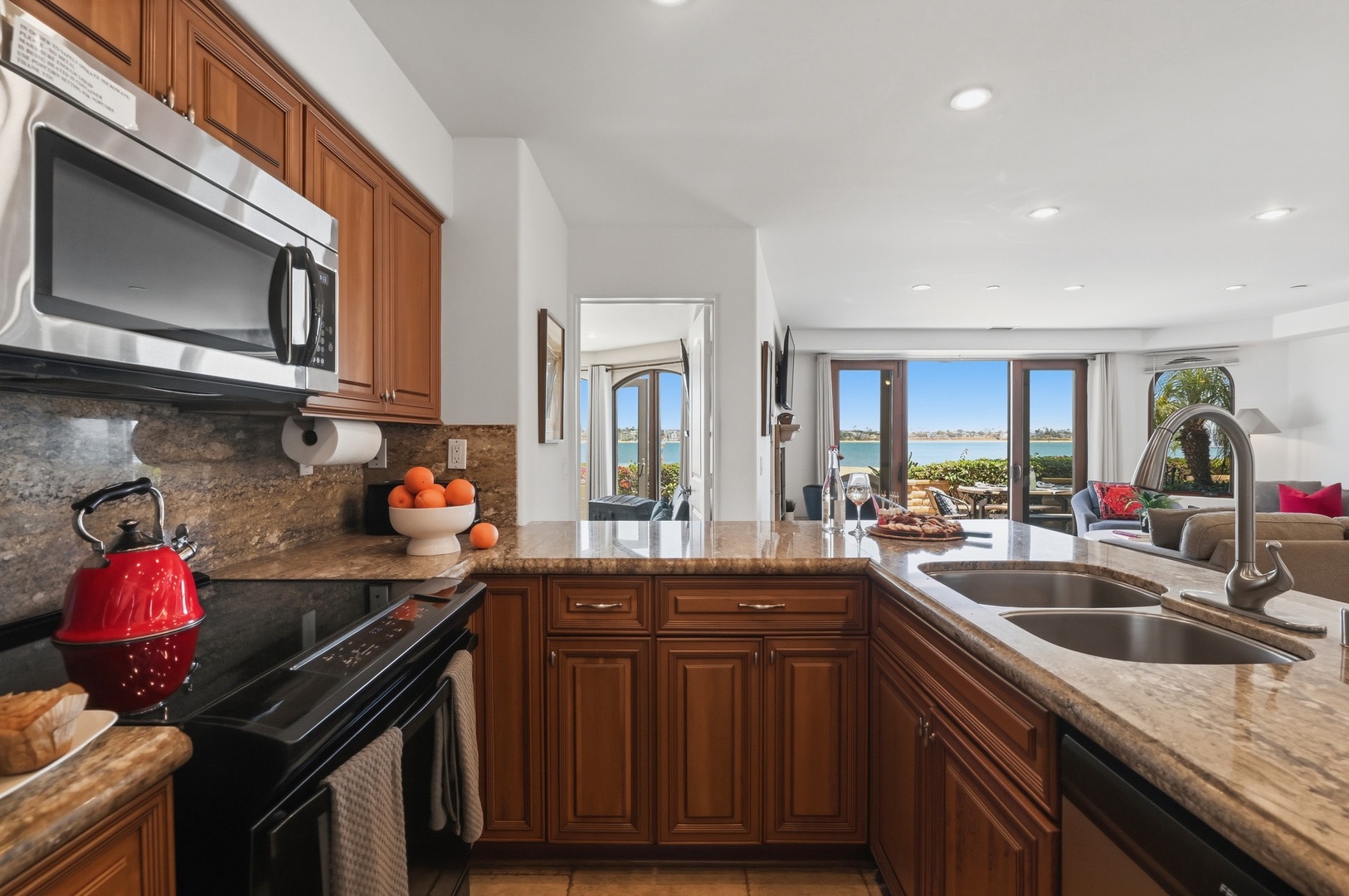 Your kitchen features granite counters, modern appliances, and stunning ocean views while you cook.