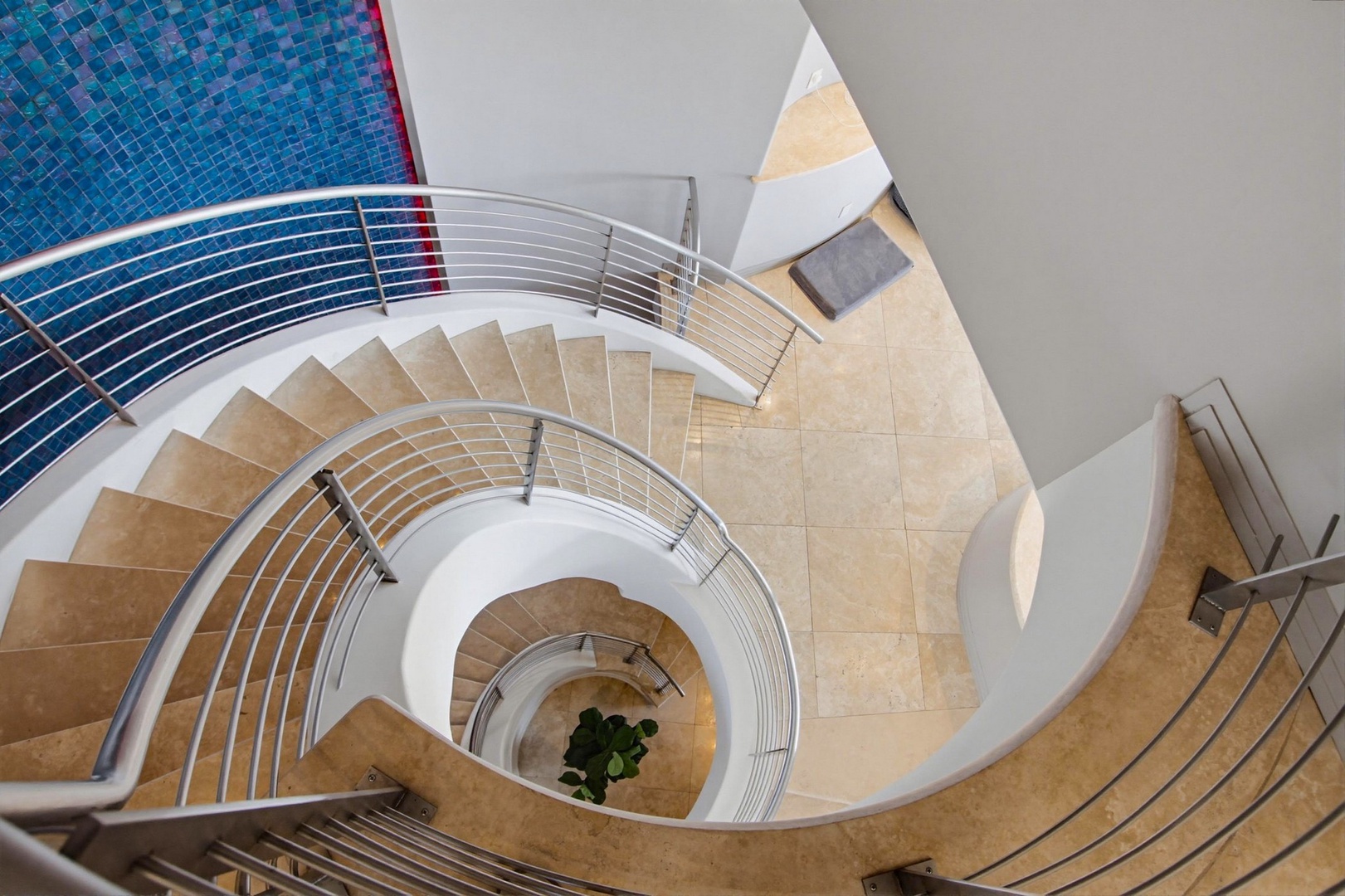 Dramatic spiral staircase to the lower levels