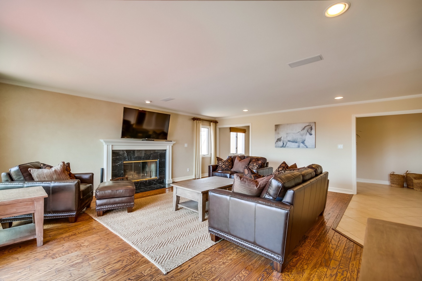 Living room with fireplace & flat-screen TV