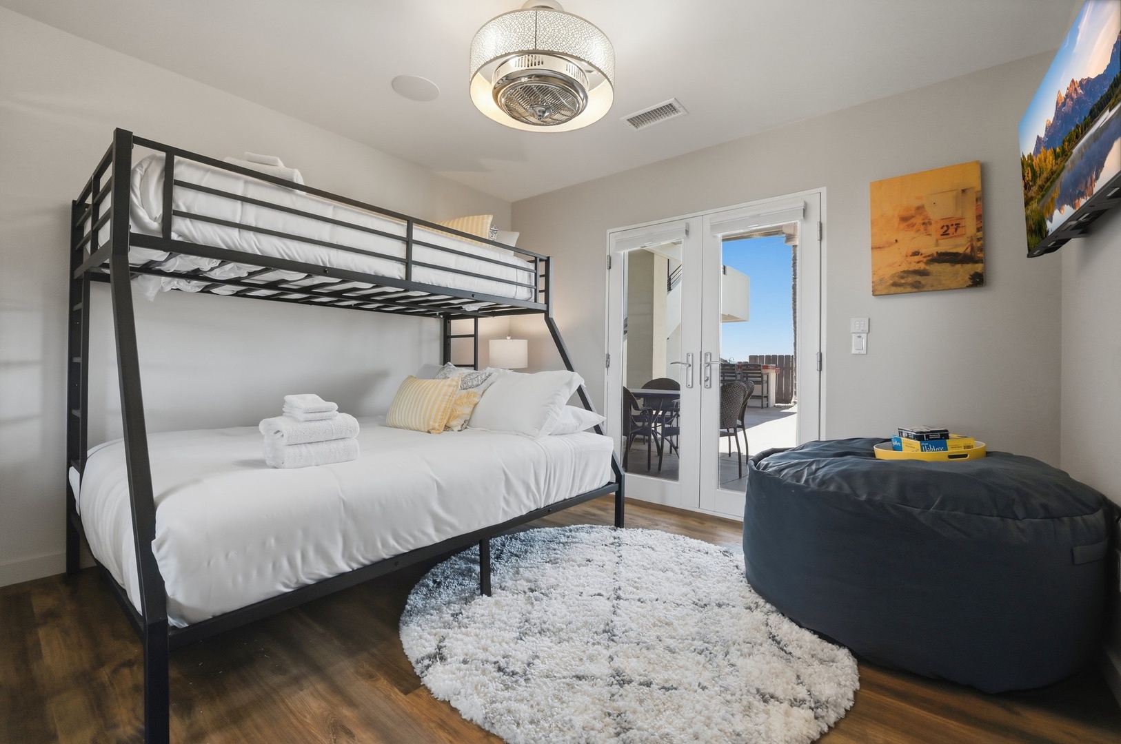 Your modern bedroom features a sleek bunk bed and private balcony access, perfect for families seeking comfort and style.