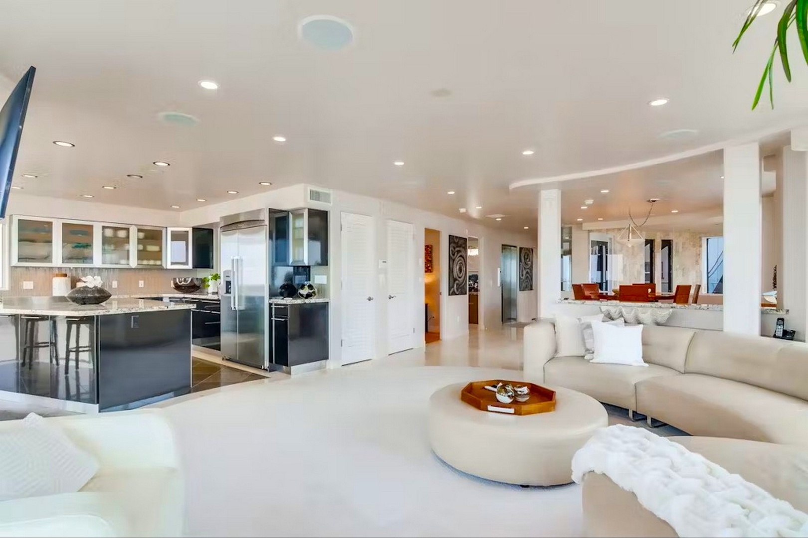 Step into a light-filled, modern sanctuary where sleek design meets comfort. Your open-concept living space flows effortlessly into a gourmet kitchen, perfect for hosting or unwinding.