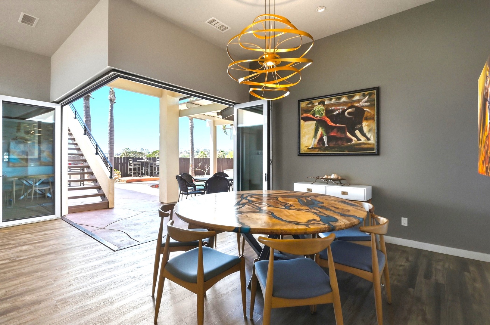 Your stylish dining space features artistic details and opens to a sun-soaked patio for memorable meals.