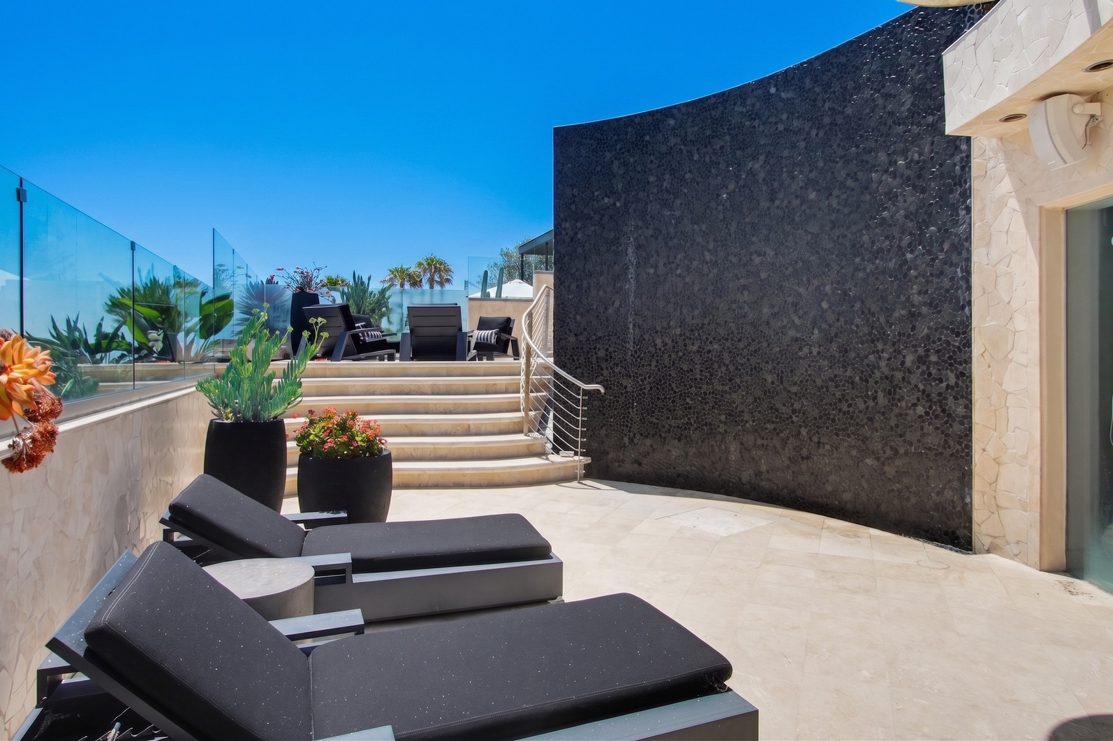 Lounge on the private terrace beneath blue skies