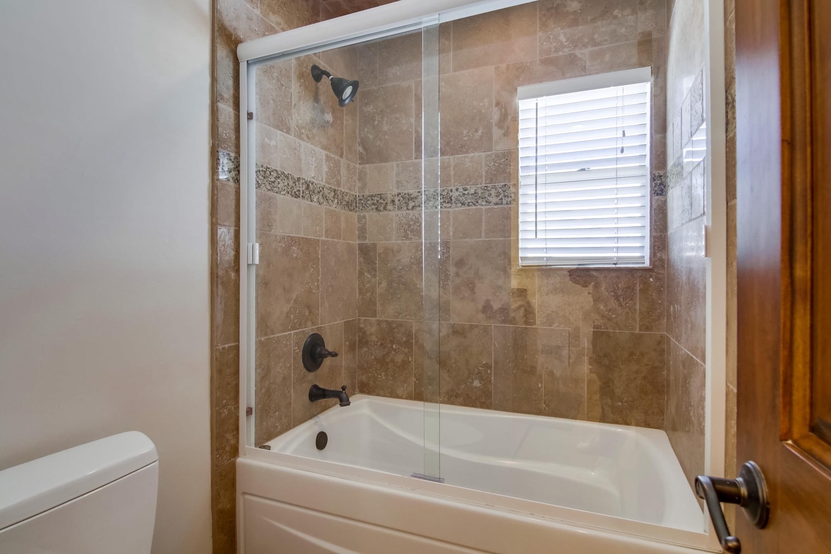 Shared bathroom with tub/shower combo