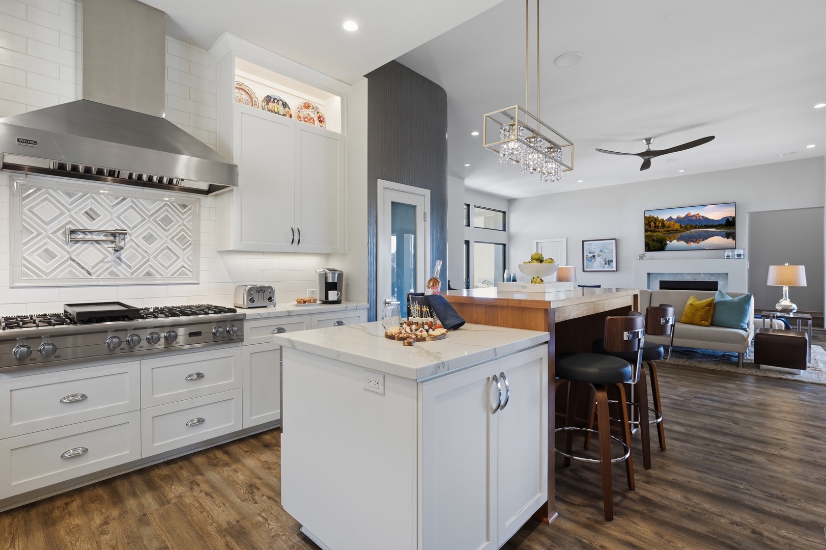 Step into your gourmet kitchen with premium appliances, marble counters, and an elegant island perfect for morning coffee.