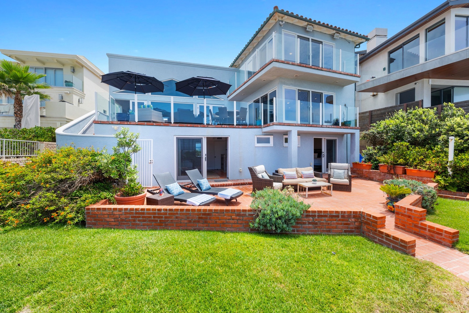 Oceanfront patio and grass yard