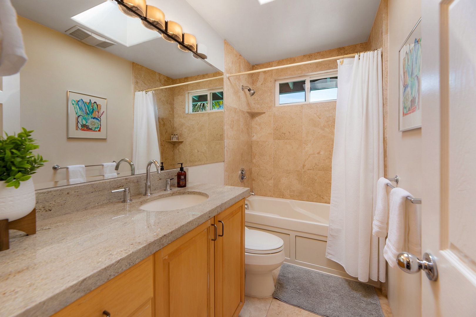 Hallway bathroom with tub shower