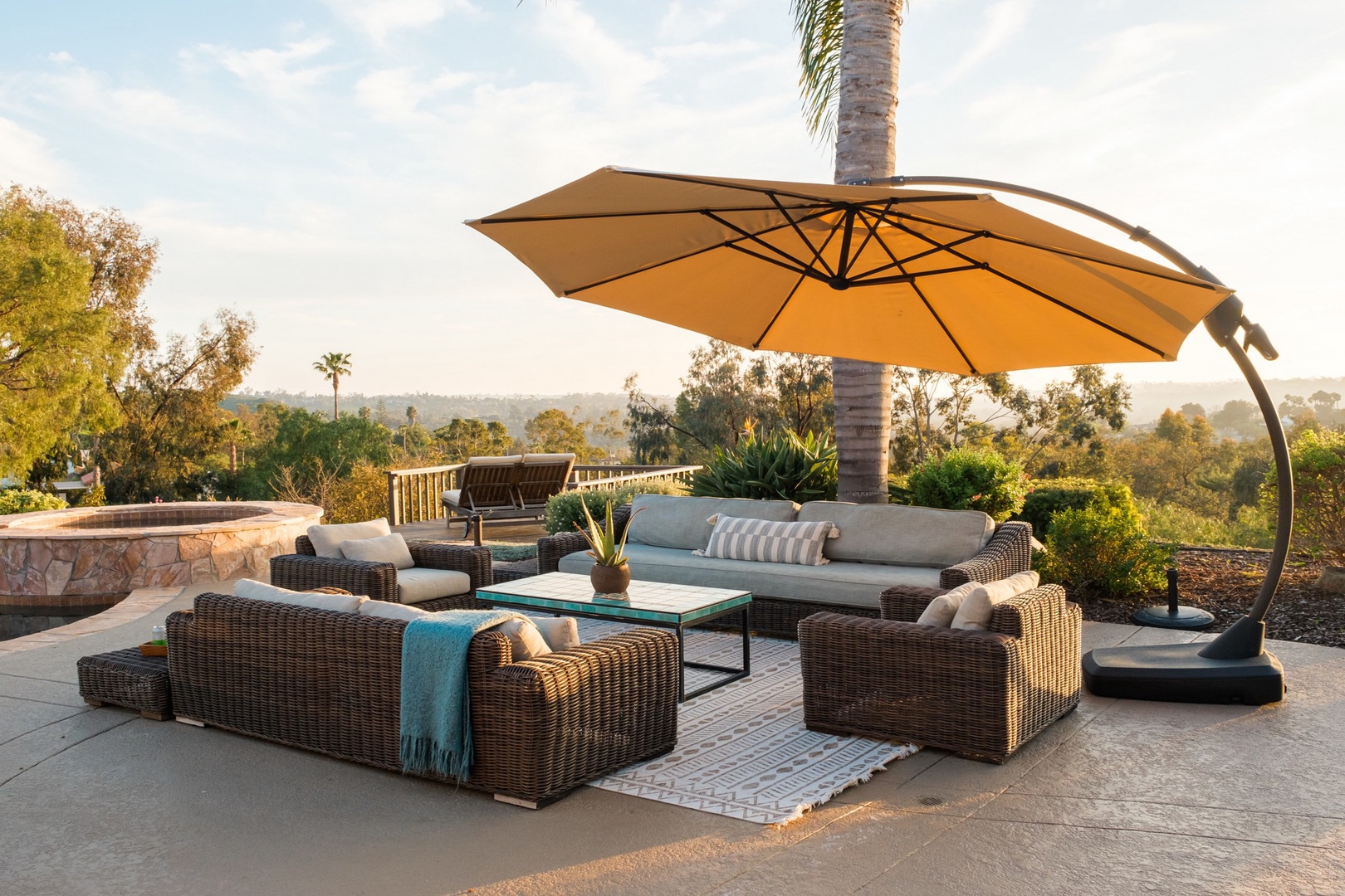 Umbrella shaded poolside lounge