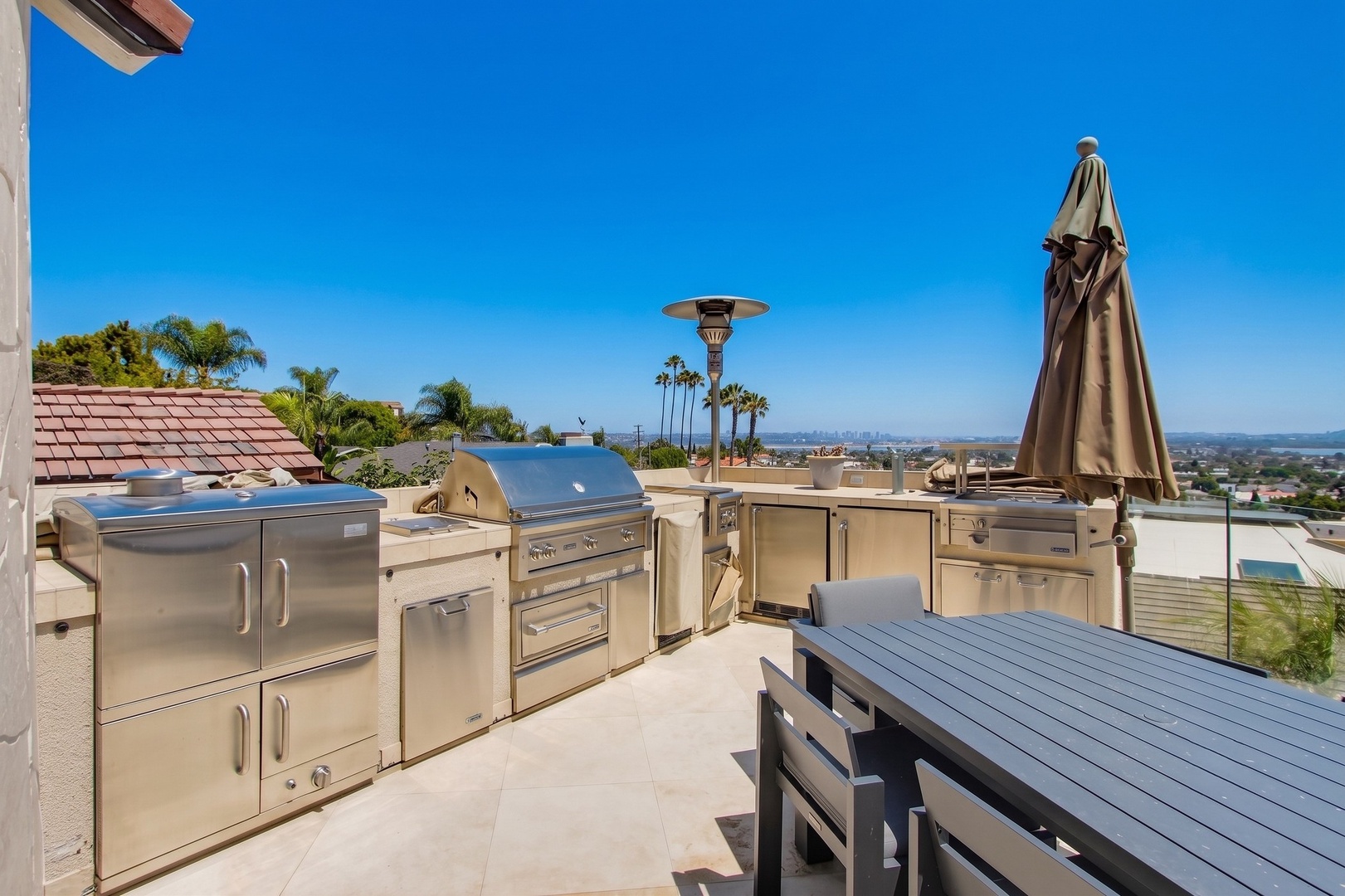 Dining terrace with an outdoor kitchen