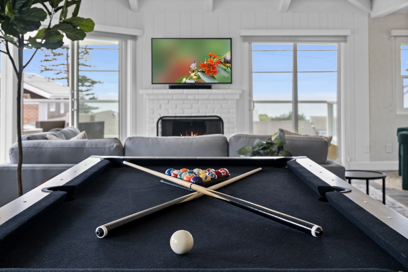Family room with pool table and views