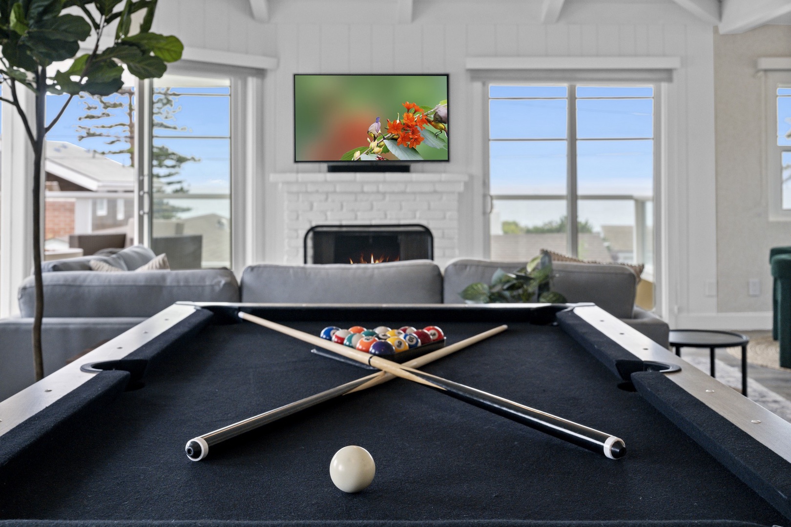 Upper level family room with pool table and views