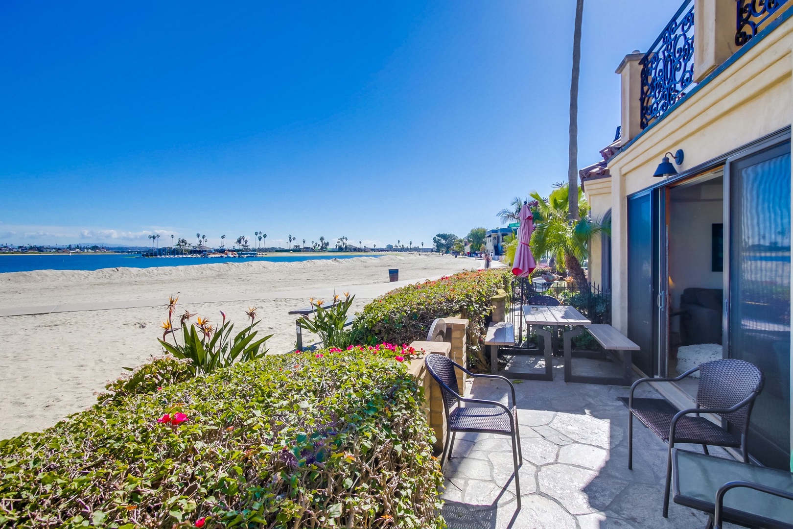 Beachfront patio with dining table