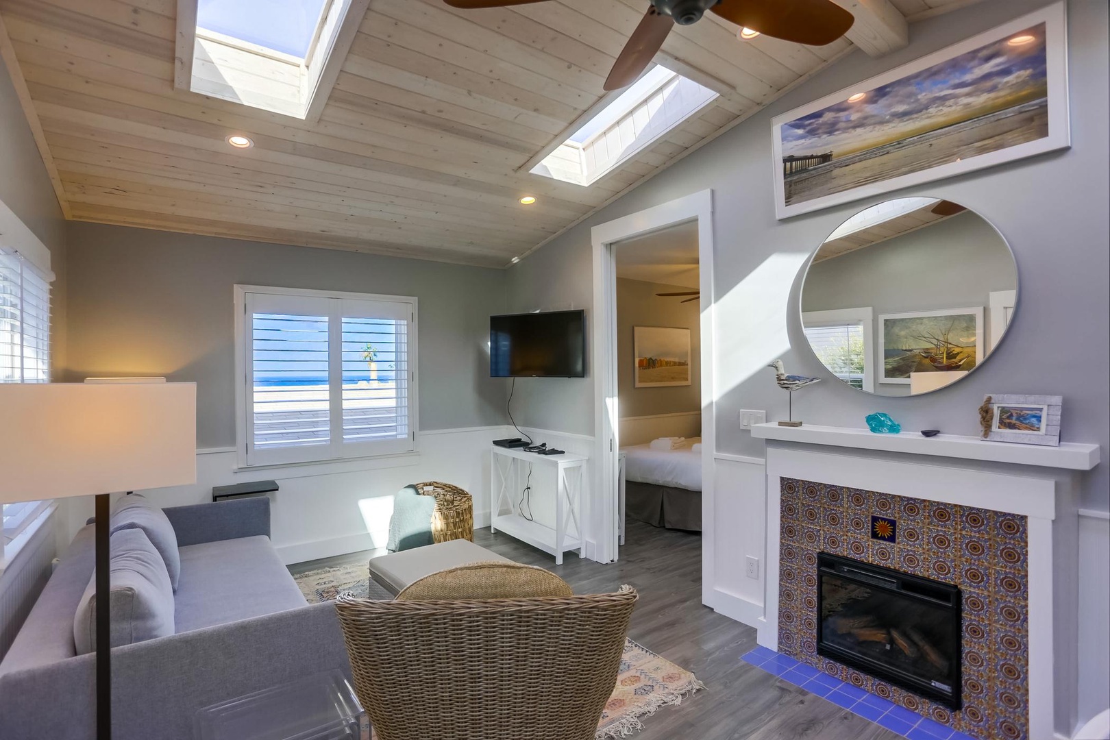 Living area with skylights and fireplace