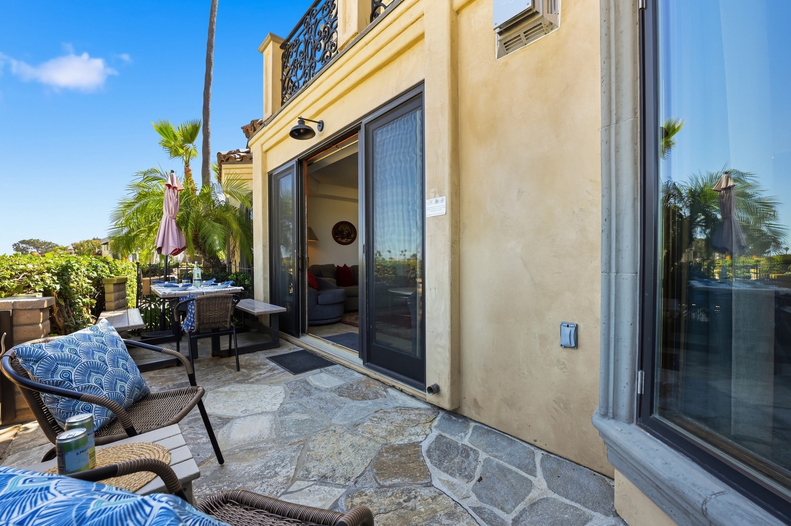 Step onto your private terrace where tropical palms sway and comfortable seating awaits your morning coffee or evening unwind.