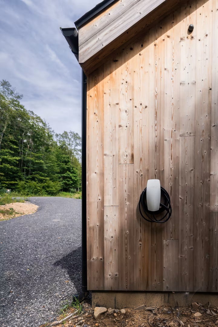 EV-friendly stay with a Tesla Universal Wall Connector located next to driveway
