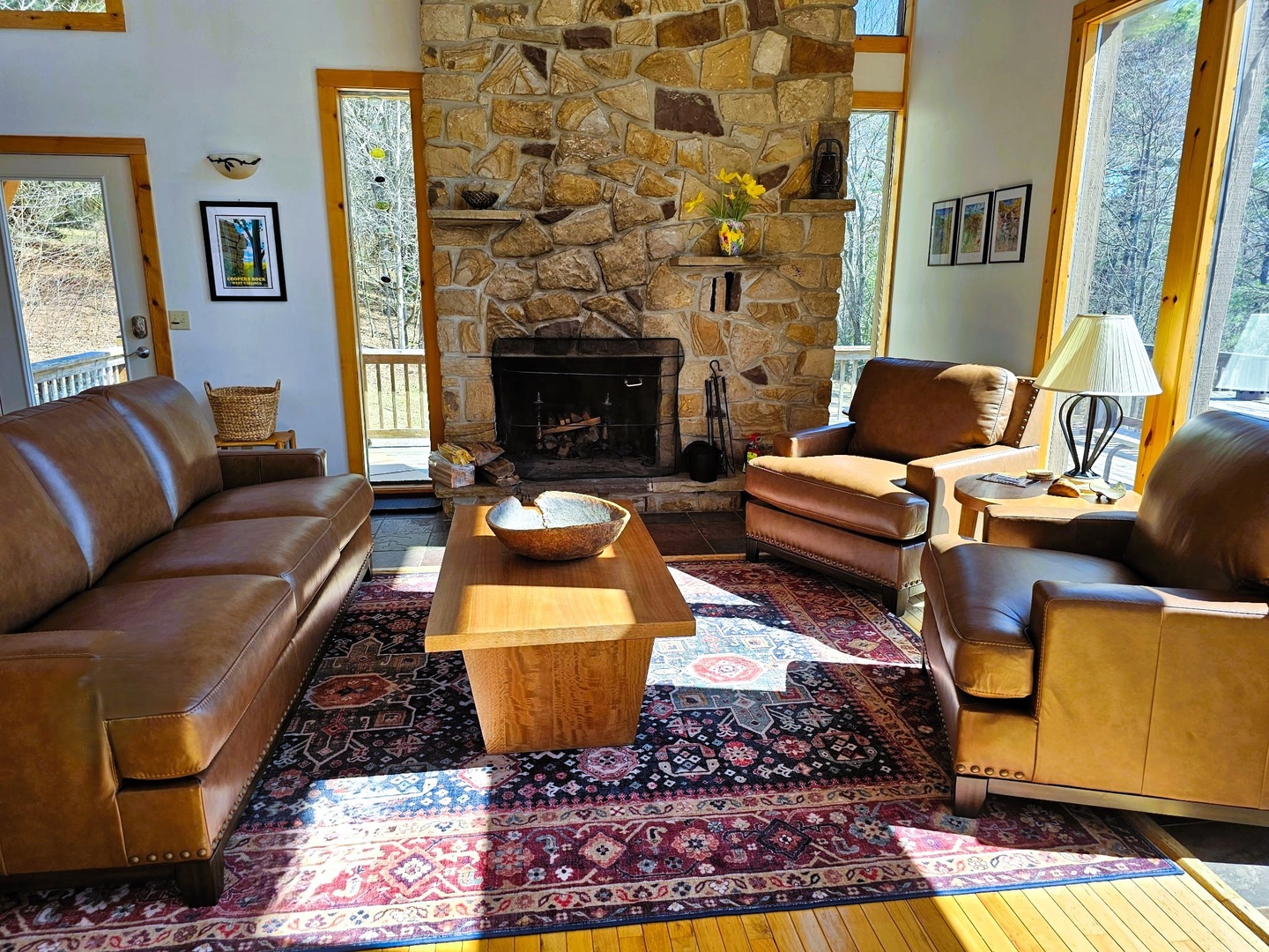 Sink into rich leather seating by your crackling stone fireplace, where cozy mountain views frame perfect evenings together.