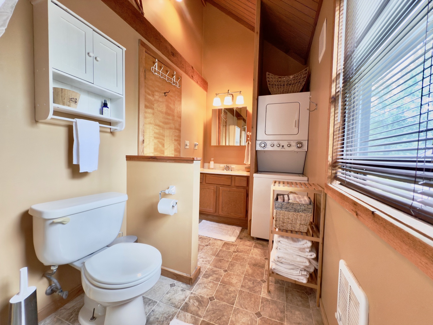 Refresh in your charming bathroom with rustic wood ceilings and thoughtful touches like fresh towels and in-unit laundry.