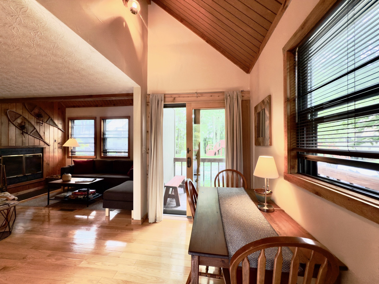 Unwind in this warm cabin-style space where natural wood and cozy seating create your perfect mountain retreat.