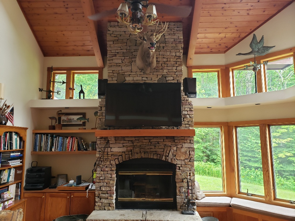 Living Room with Wood Fireplace and Smart TV