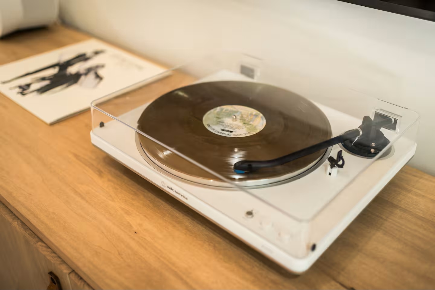 Set the mood for your stay with vintage vinyl on the stylish turntable, ready to spin your favorite records and fill your space with warm, authentic sound.