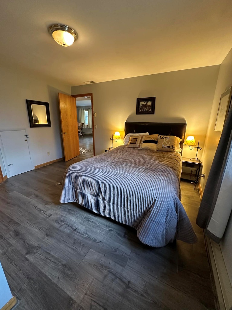 Downstairs: bedroom w/ queen and bath