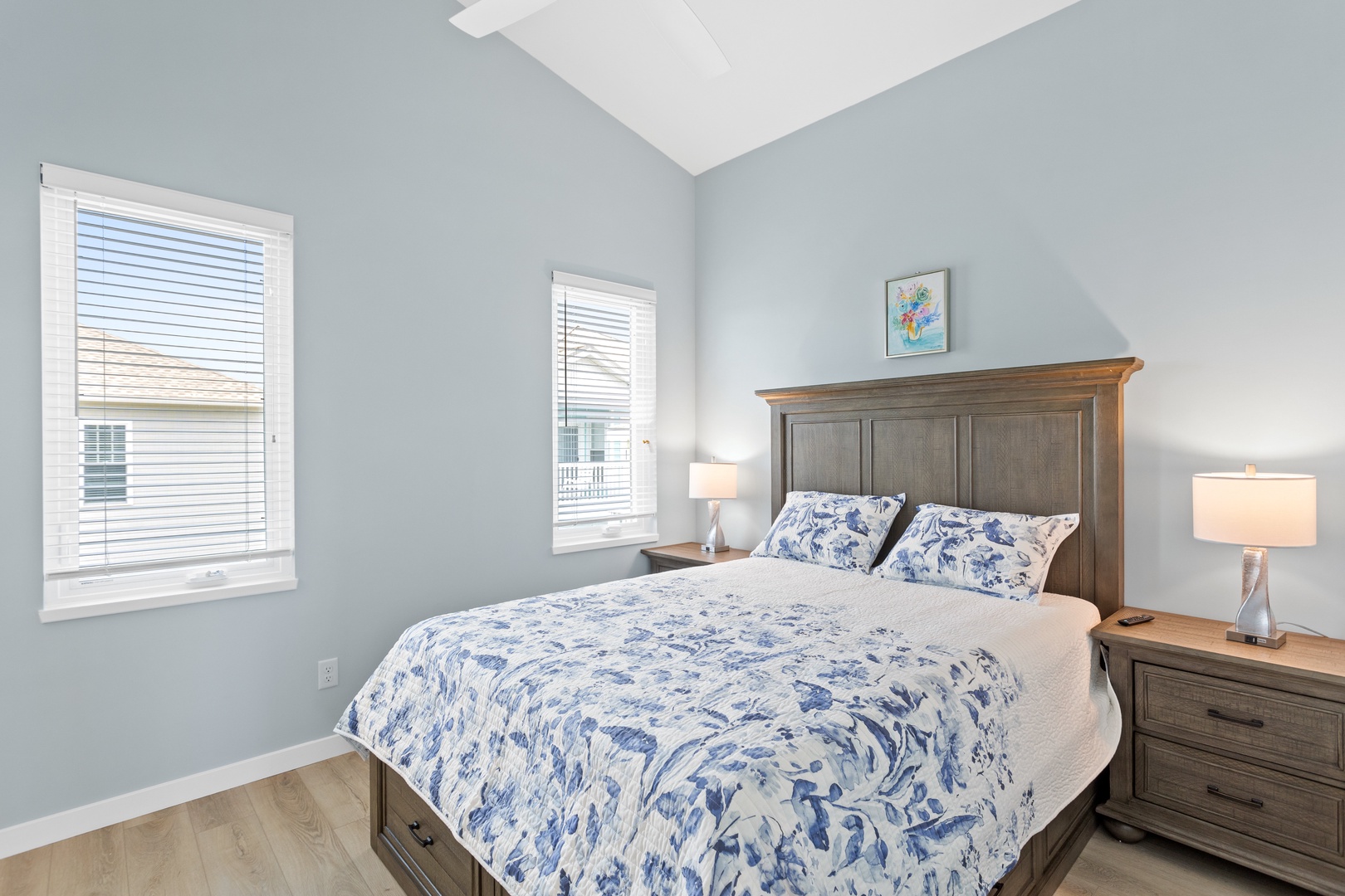 The guest bedroom with a queen-sized bed and Smart TV