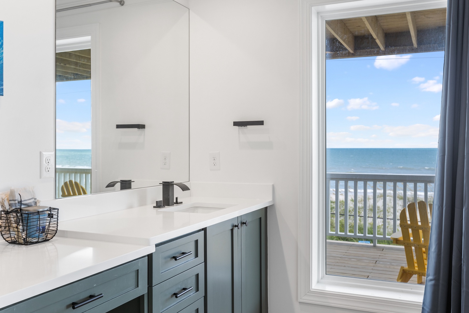 The primary ensuite with a a dual vanity, walk-in shower, and tub