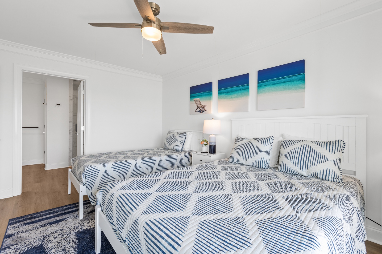 Bedroom 5 with a queen-sized bed, twin bed, Smart TV, ensuite, and balcony access
