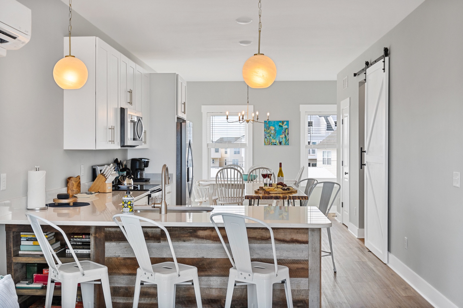 The well-stocked kitchen with countertop seating for 5