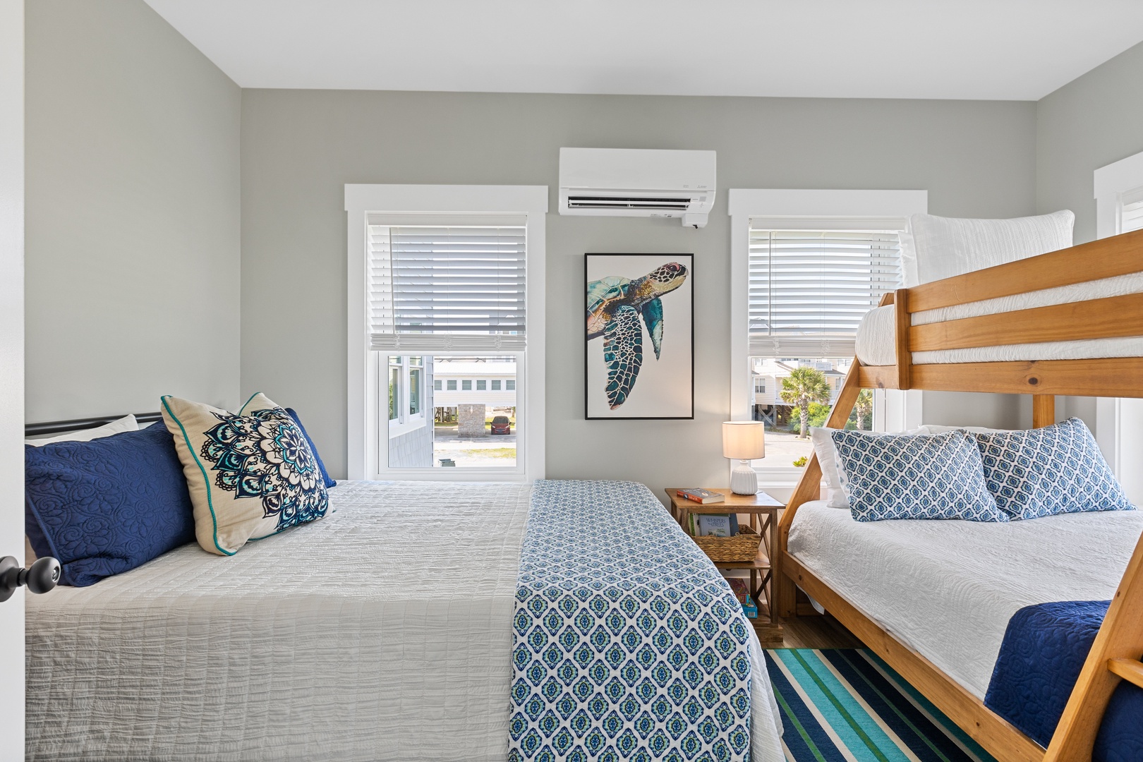 Bedroom 3 offers a queen-sized bed, a full/twin bunk bed, and a Smart TV