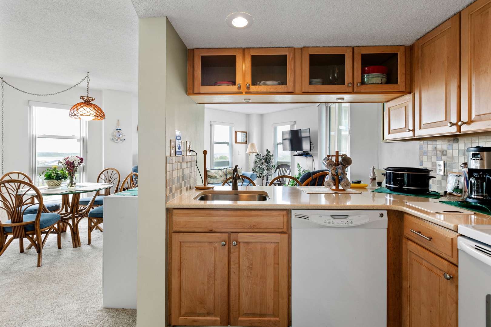 The well-stocked kitchen with countertop seating for 3